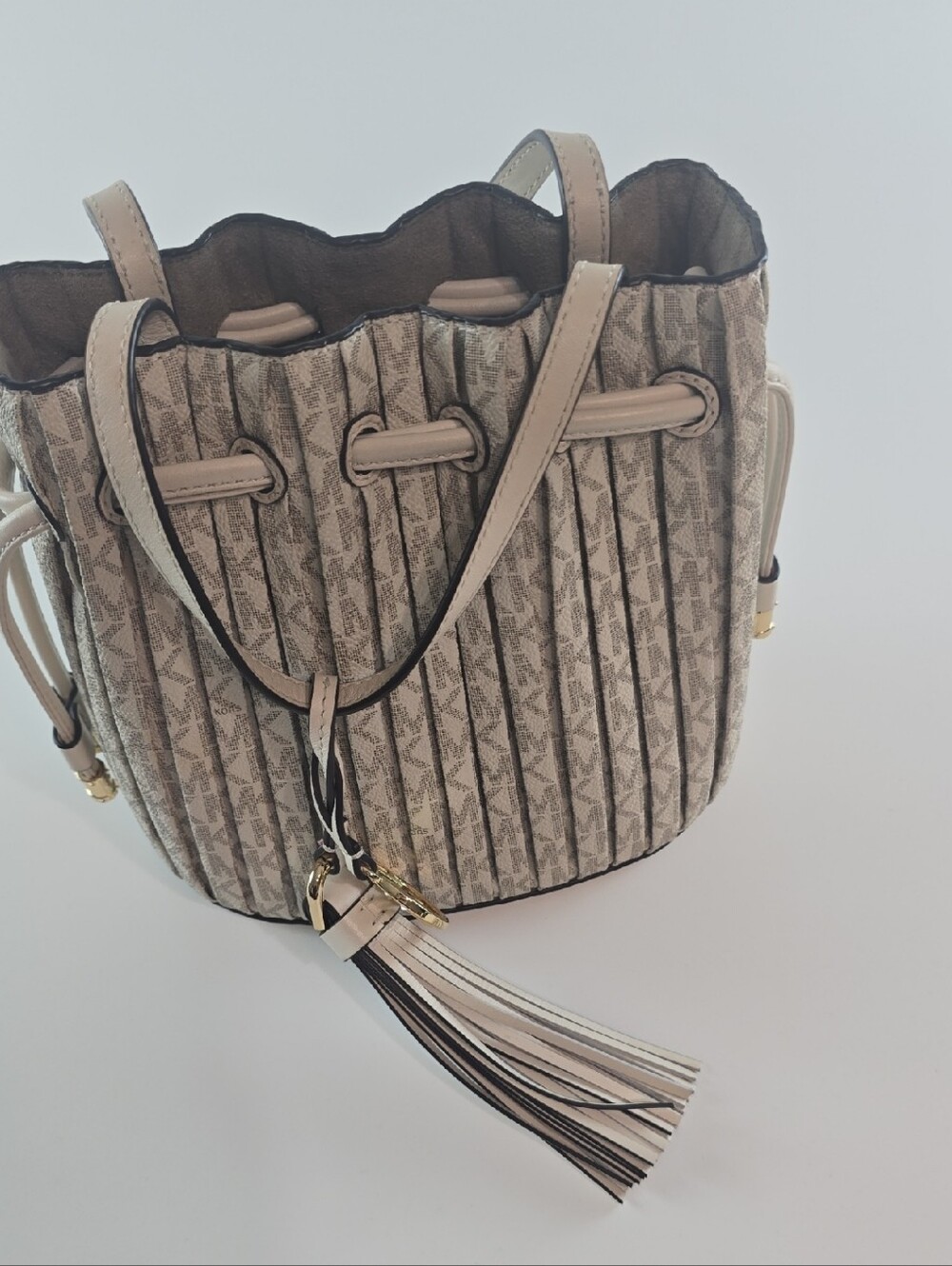Michael Kors Pleated Monogram Drawstring Bucket Bag in Beige and Black Trim